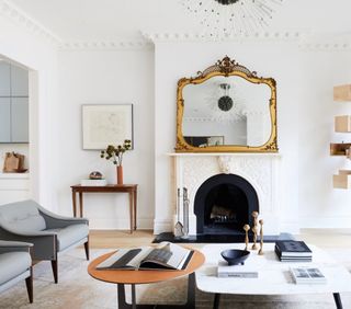 Vintage-style mirror above the mantel