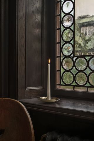 Wastberg Holocene candleholder in brass by Ilse Crawford on wooden window sill