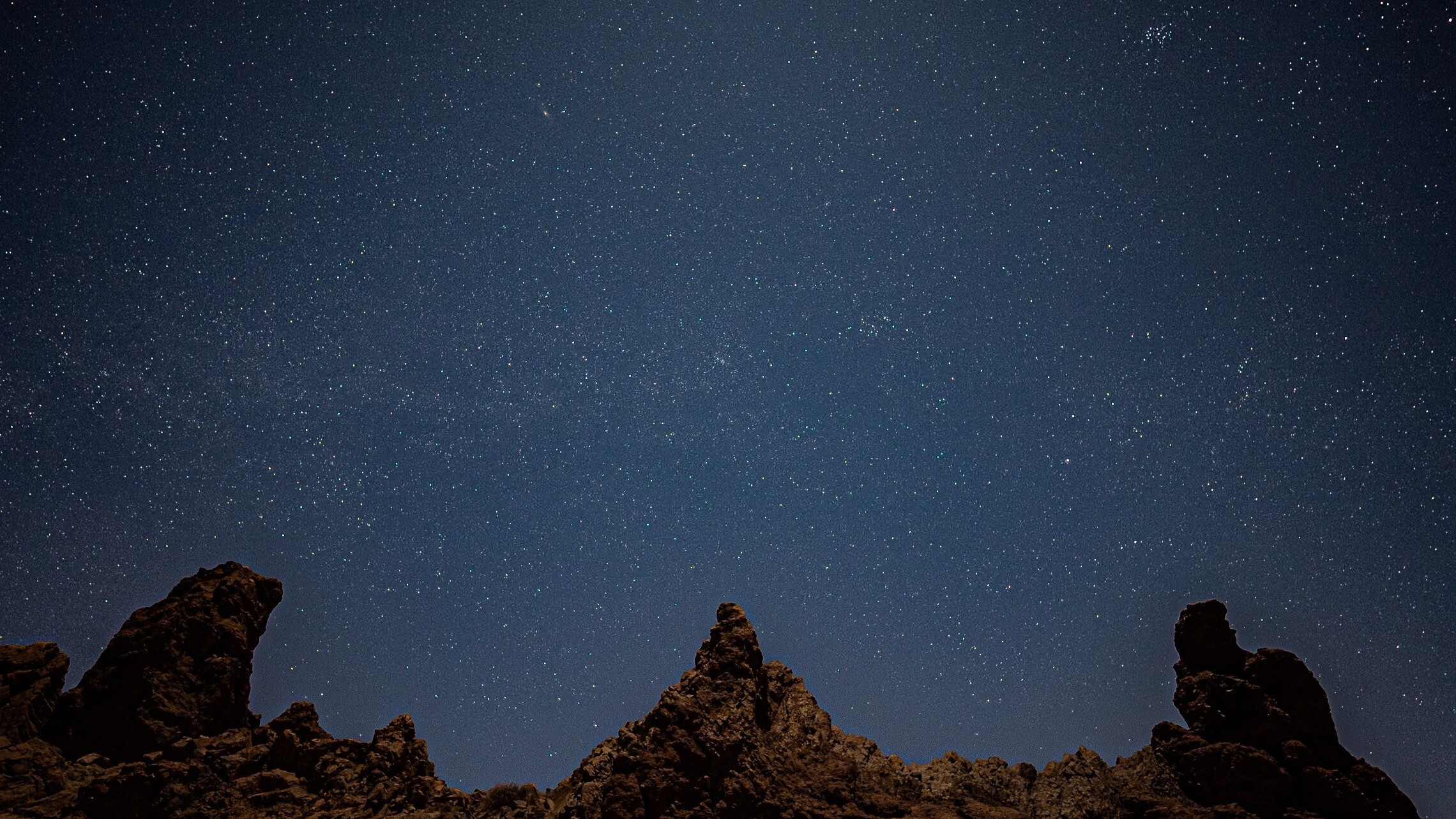 starry sky above interesting rock formation