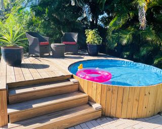 above ground pool with decking and steps