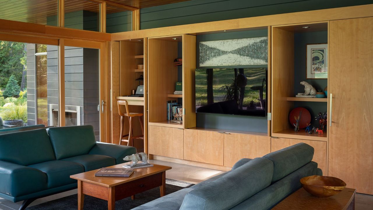 An entertainment centre with wooden cabinets and a hidden tv console