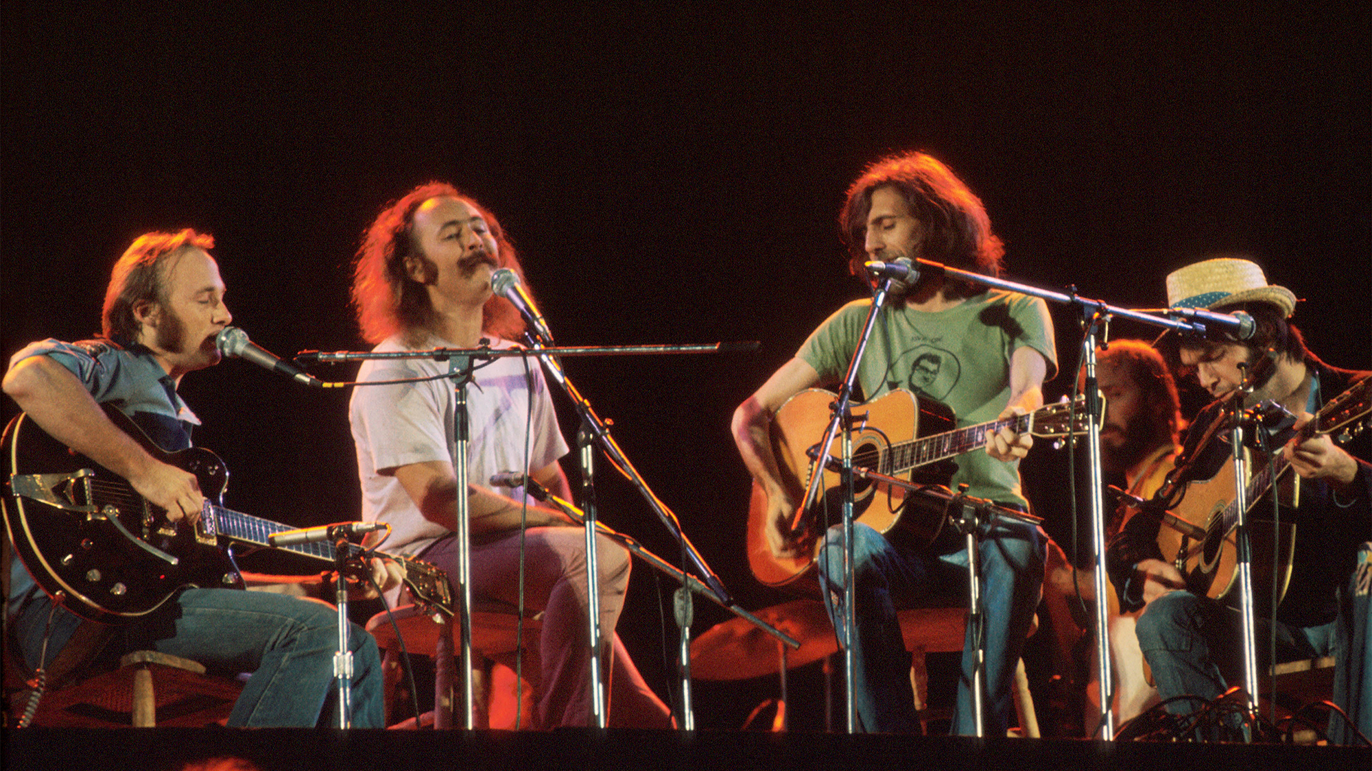 Crosby Stills Nash and Young perform on stage at Wembley Stadium, London, 14th September 1974, L-R Stephen Stills, David Crosby, Graham Nash, Neil Young.