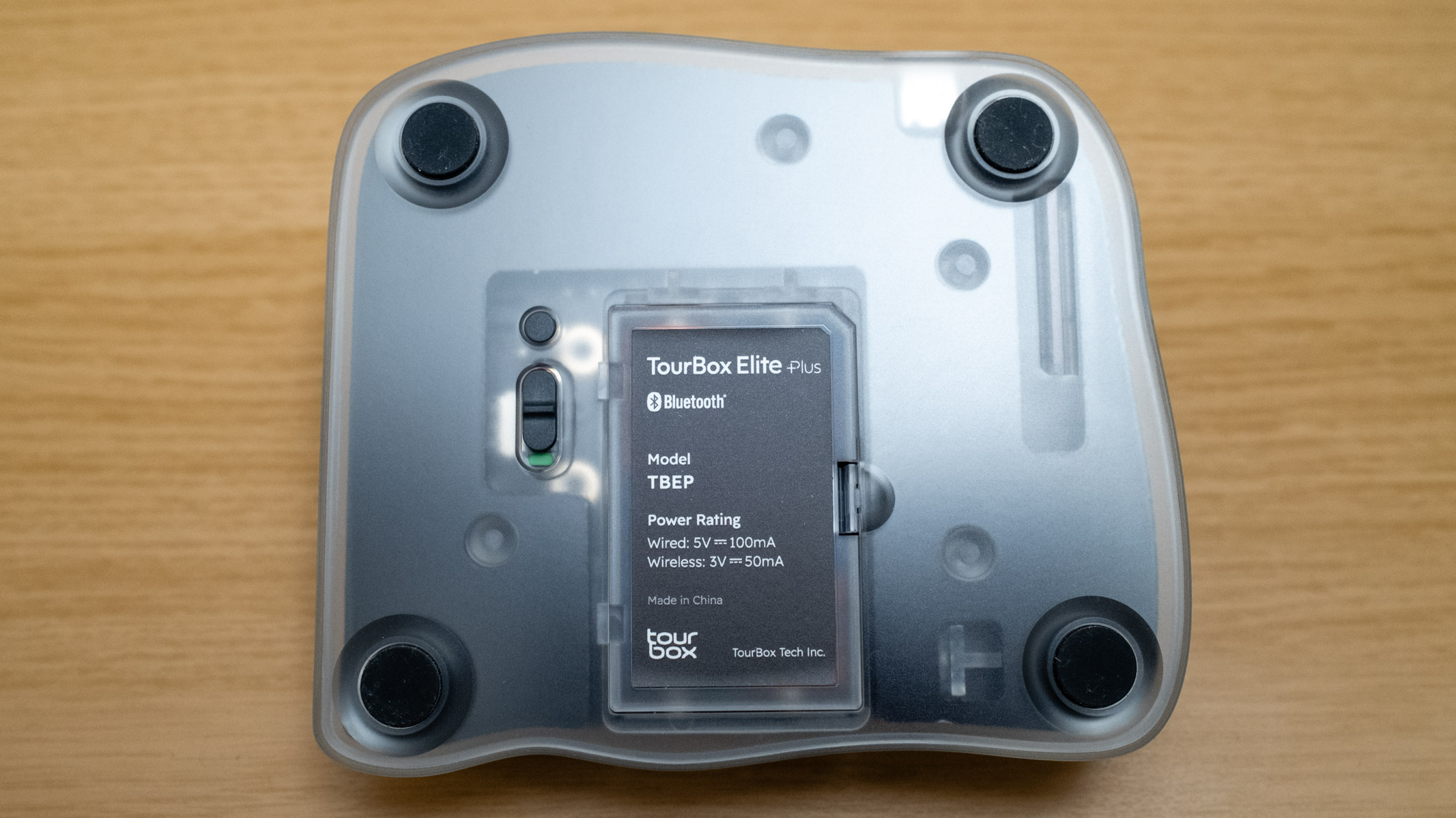 Tourbox Elite Plus bottom view showing battery compartment