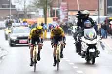 Christophe Laporte and Wout van Aert exchange a few words on the way to the Gent-Wevelgem finish