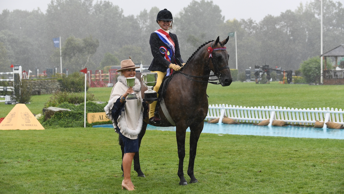 Standing still in the show ring includes for the rosette and trophy presentation