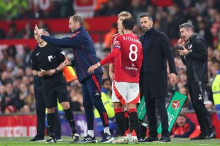 MANCHESTER, ENGLAND - OCTOBER 30: Bruno Fernandes of Manchester United and Ruud van Nistelrooy the interim head coach / manager of Manchester United during the Carabao Cup Fourth Round match between Manchester United and Leicester City at Old Trafford on October 30, 2024 in Manchester, England. (Photo by Robbie Jay Barratt - AMA/Getty Images)