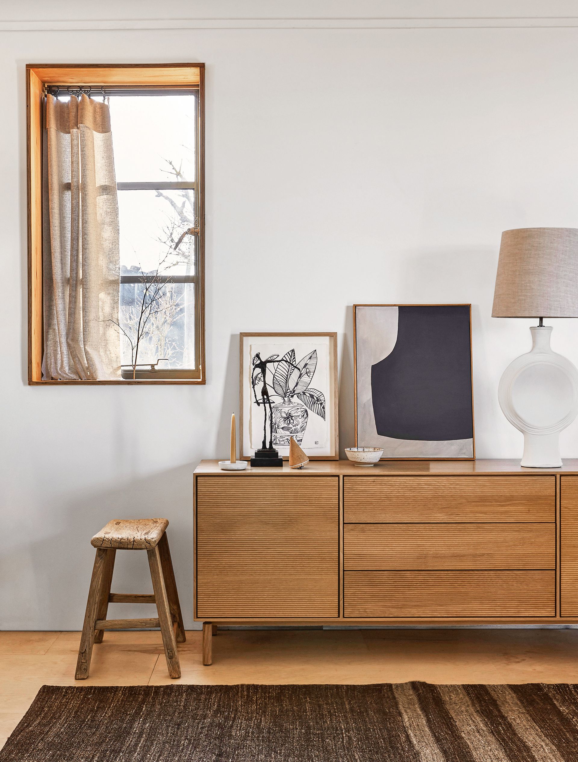 Art leaning on a sideboard