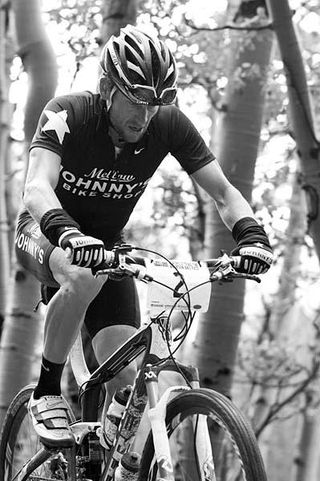 Nearing the top of the tree line, Lance Armstrong keep the heat on - never dialing back the effort.