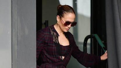 Jennifer Lopez in a red plaid dress and matching bra top