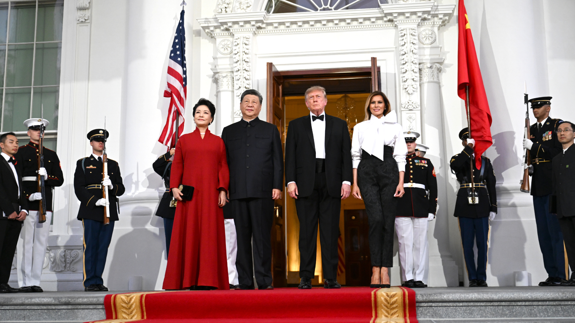 Peng Liyuan, China's first lady, from left, Xi Jinping, China's president, U.S. President Donald Trump, and first lady Melania Trump in front of the White House