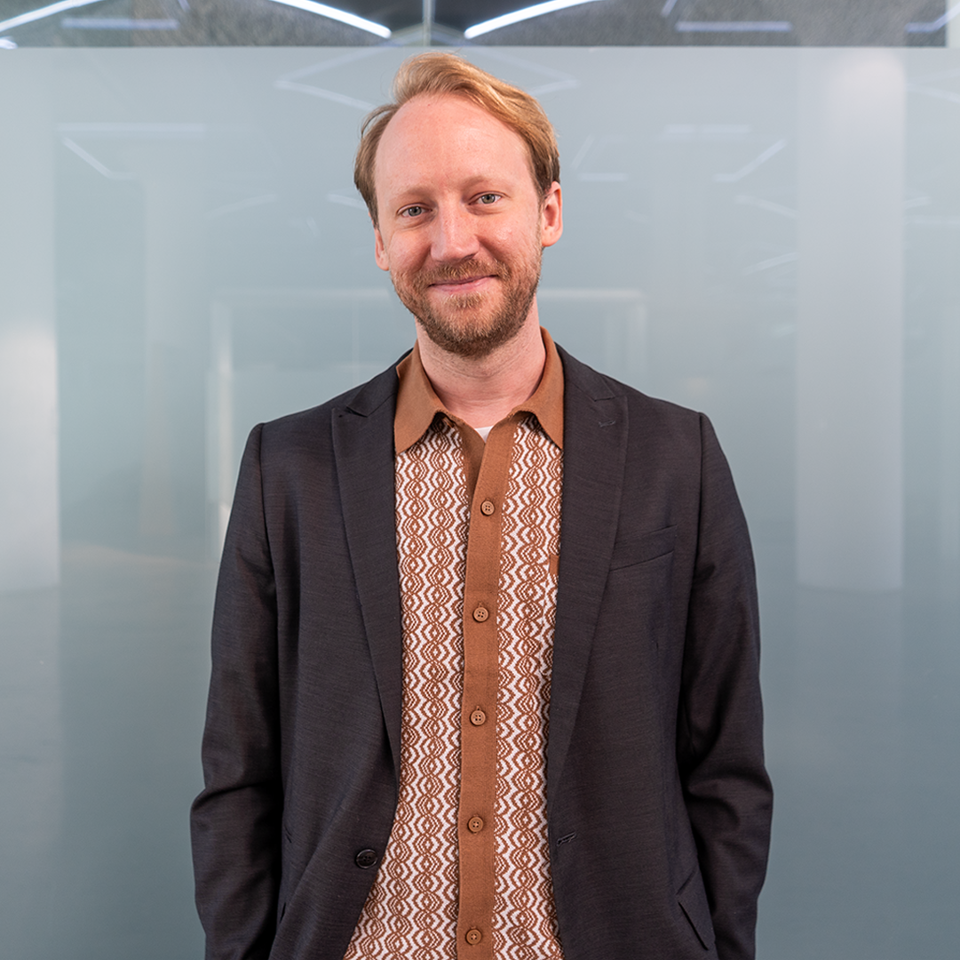 Smiling headshot of Andrew Goulson.