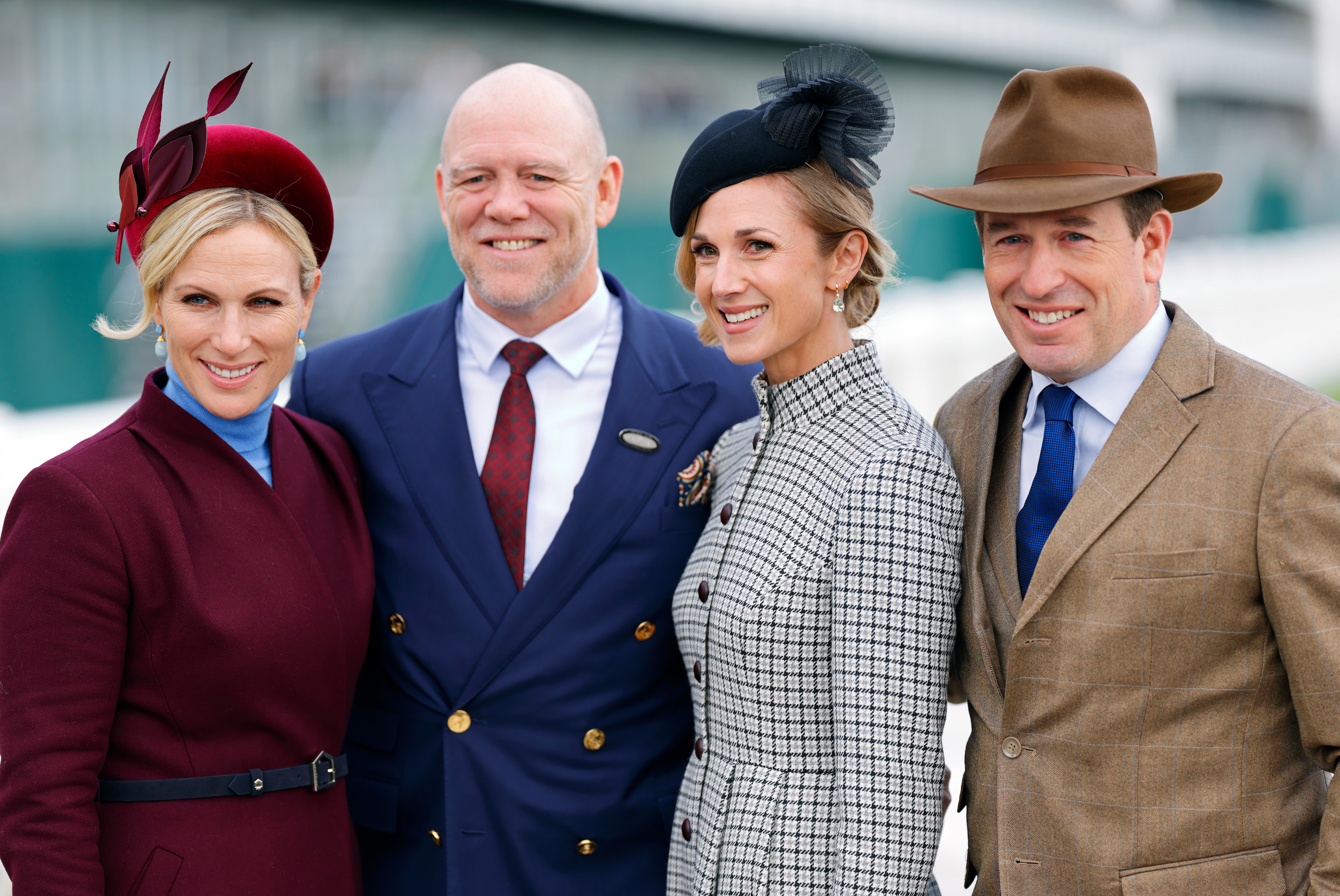 Zara and Mike Tindall posing with Harriet Sperling and Peter Phillips at Cheltenham racecourse