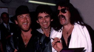 Deep Purple’s Roger Glover and Jon Lord with George Harrison in 1984
