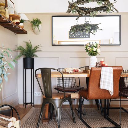 neutral dining room with wooden table and leather chair