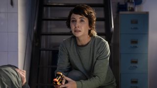 Mavournee Hazel's Bluebird Gleeson seated with a worried expression on her face in NCIS: Sydney Season 3