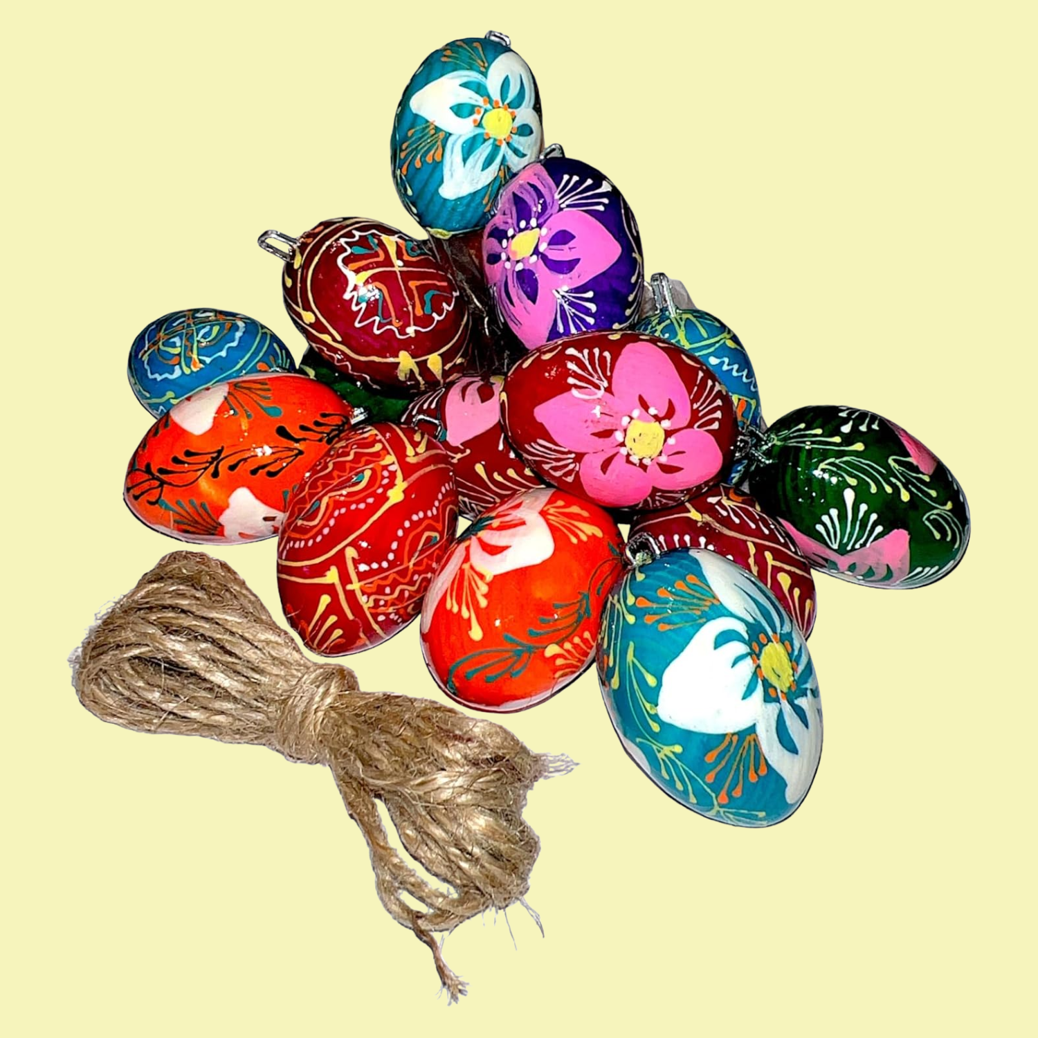 A bundle of colorful Easter egg decorations near a jute twine
