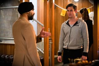 Kheerat prises Zack away from a client in EastEnders