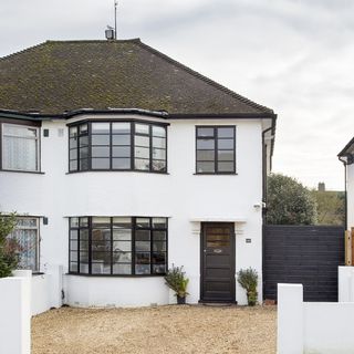house exterior with white wall and windows