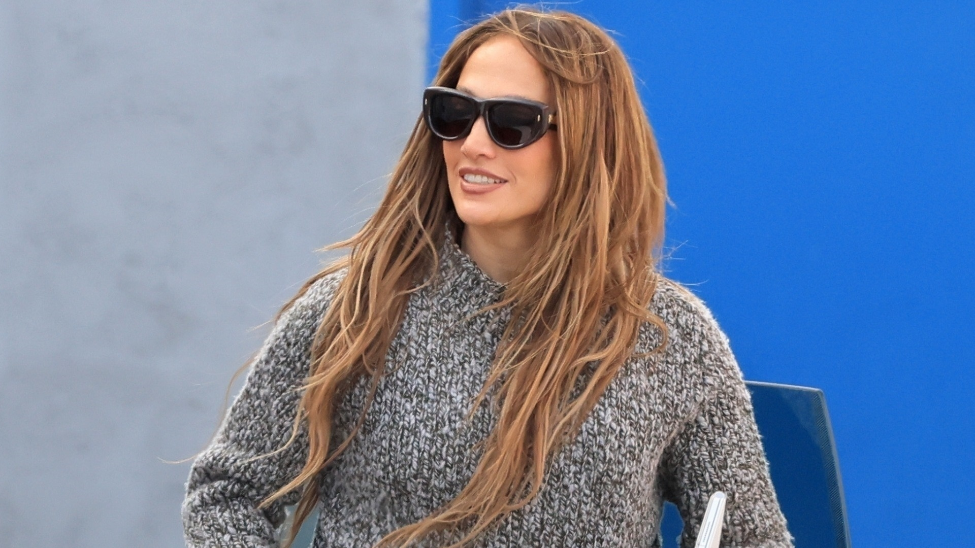 Jennifer Lopez arrived back at her dance studio in black leggings, a chunky sweater, lace-up boots, and a Dior D-Journey bag