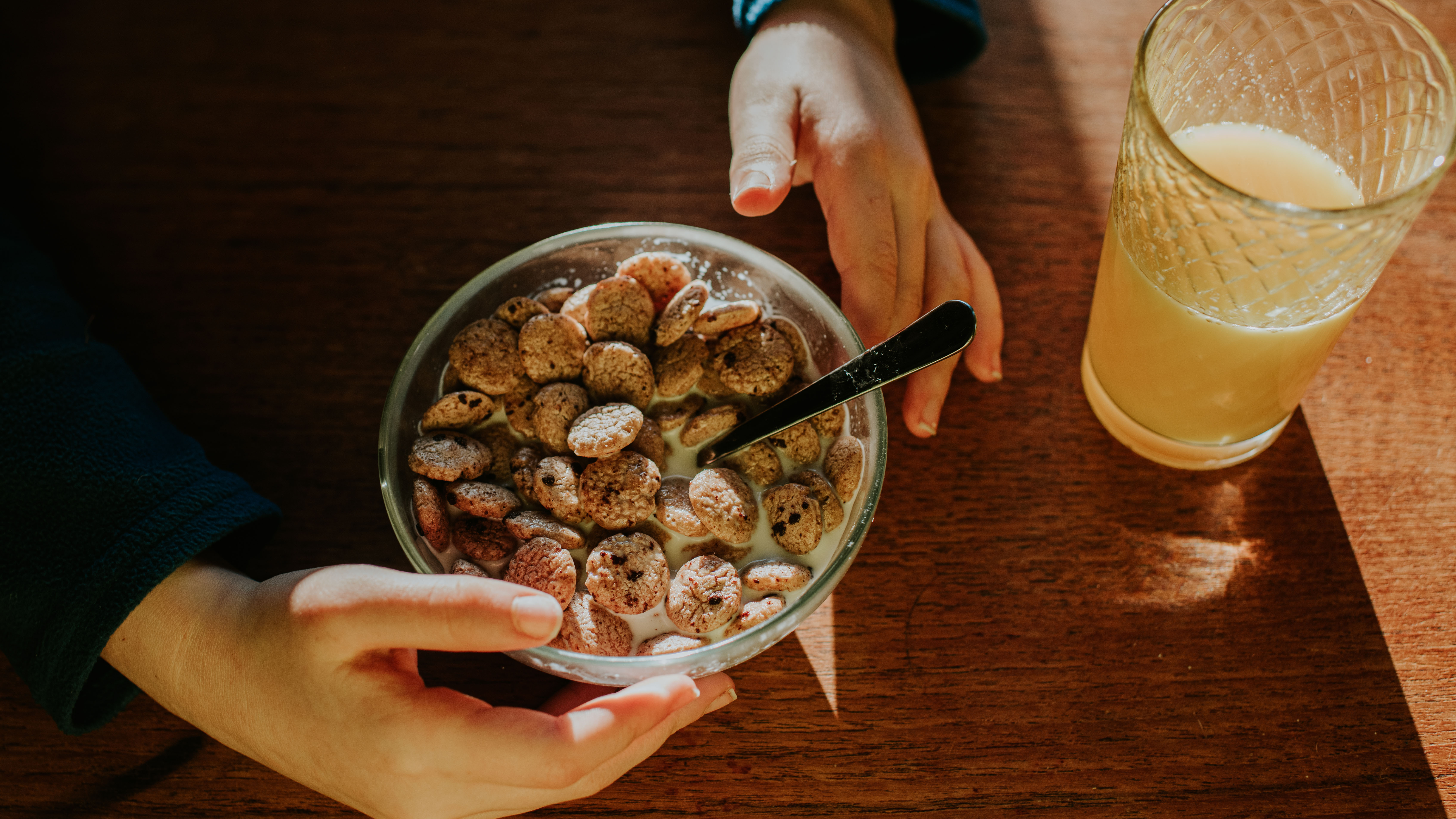 Child hands with cereal