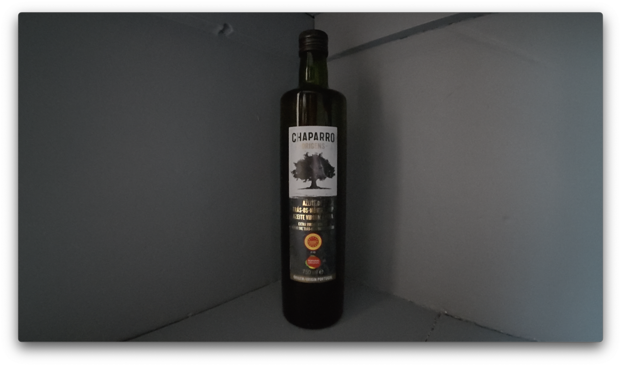 A photo of an olive oil bottle shot, a screengrab from video shot on the DJI Osmo Action 5 Pro