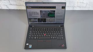 A photograph of the Lenovo ThinkPad X1 Carbon Gen 10 on a table