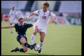 Michelle Akers of the USA and Lizzy Claydon of Australia fight for the ball during a game at Tampa Stadium in Tampa, Florida. The USA won the game 2-1. Mandatory Credit: Andy Lyons /Allsport