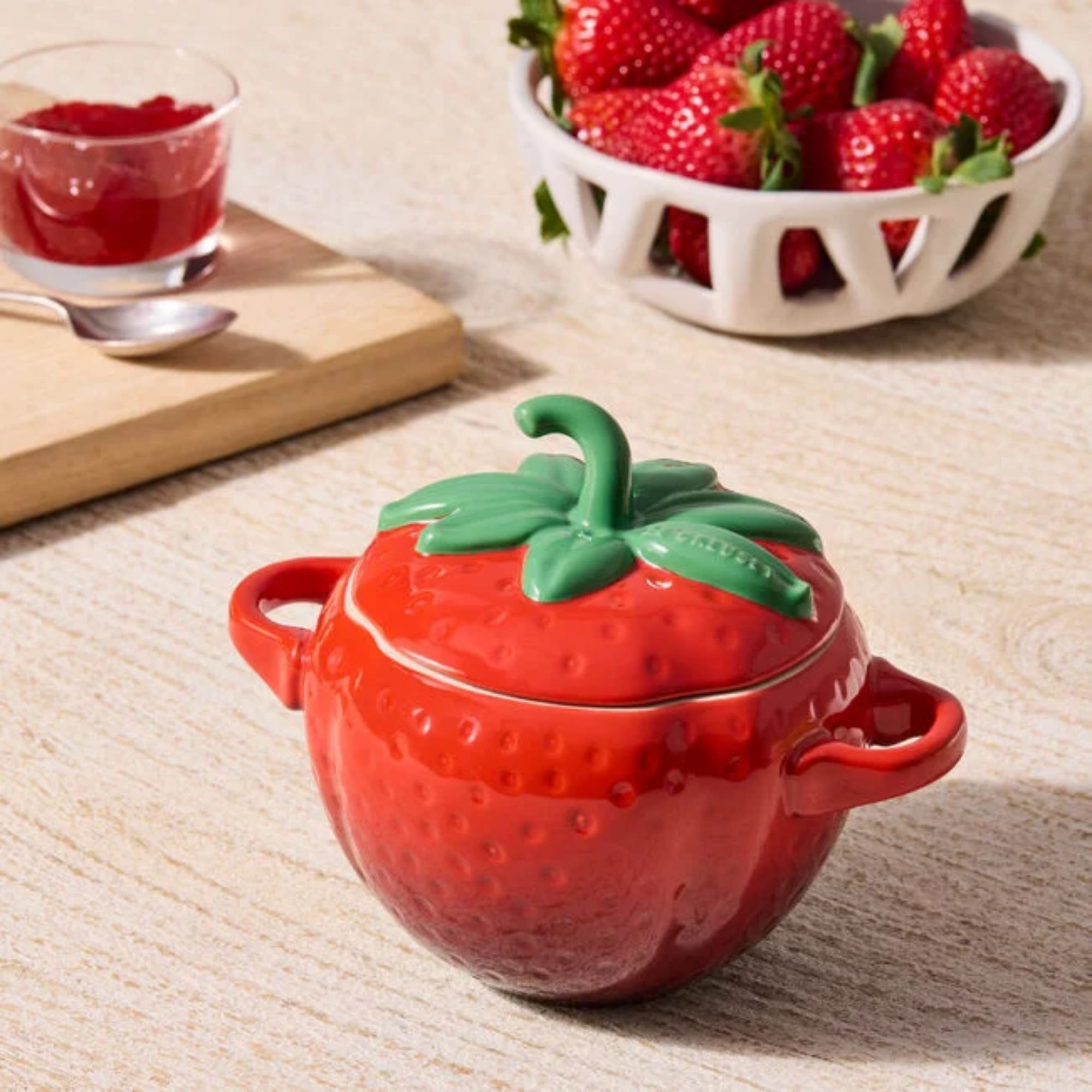 A Le Creuset mini cocotte shaped like a strawberry