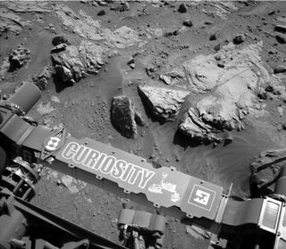 This image from the Navigation Camera on NASA's Curiosity Mars rover shows a sandstone slab on which the rover team has selected a target, "Windjana," for close-up examination. The target is on the approximately 2-foot-wide rock seen in the right half of this April 23, 2014, view.