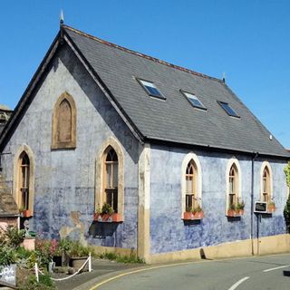 chaple with blue wall and slate roof