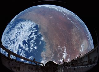 The Earth as seen from orbit, filmed in space by an IMAX camera aboard a NASA space shuttle mission in December 1988. 
