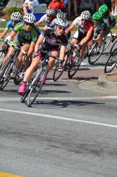 A Mellow Mushroom rider leads through turn 1.