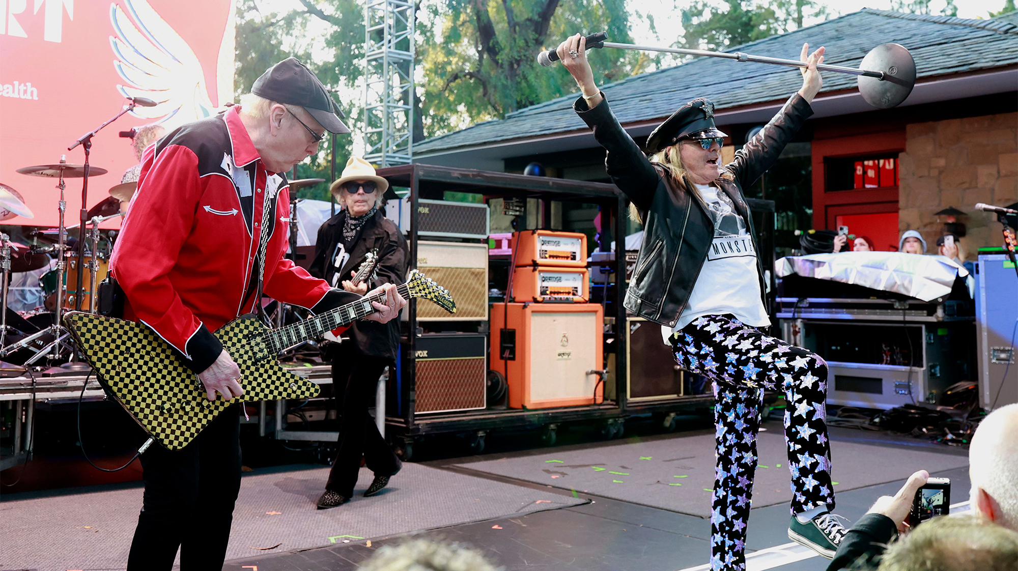 (L-R) Rick Nielsen, Tom Petersson, and Robin Zander of Cheap Trick perform onstage during the 2025 Backyard Concert supporting Teen Cancer America and the UCLA Health Center at a private residence on October 03, 2025 in Pacific Palisades, California.