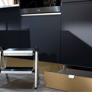 underneath cabinets with drawers in black colour