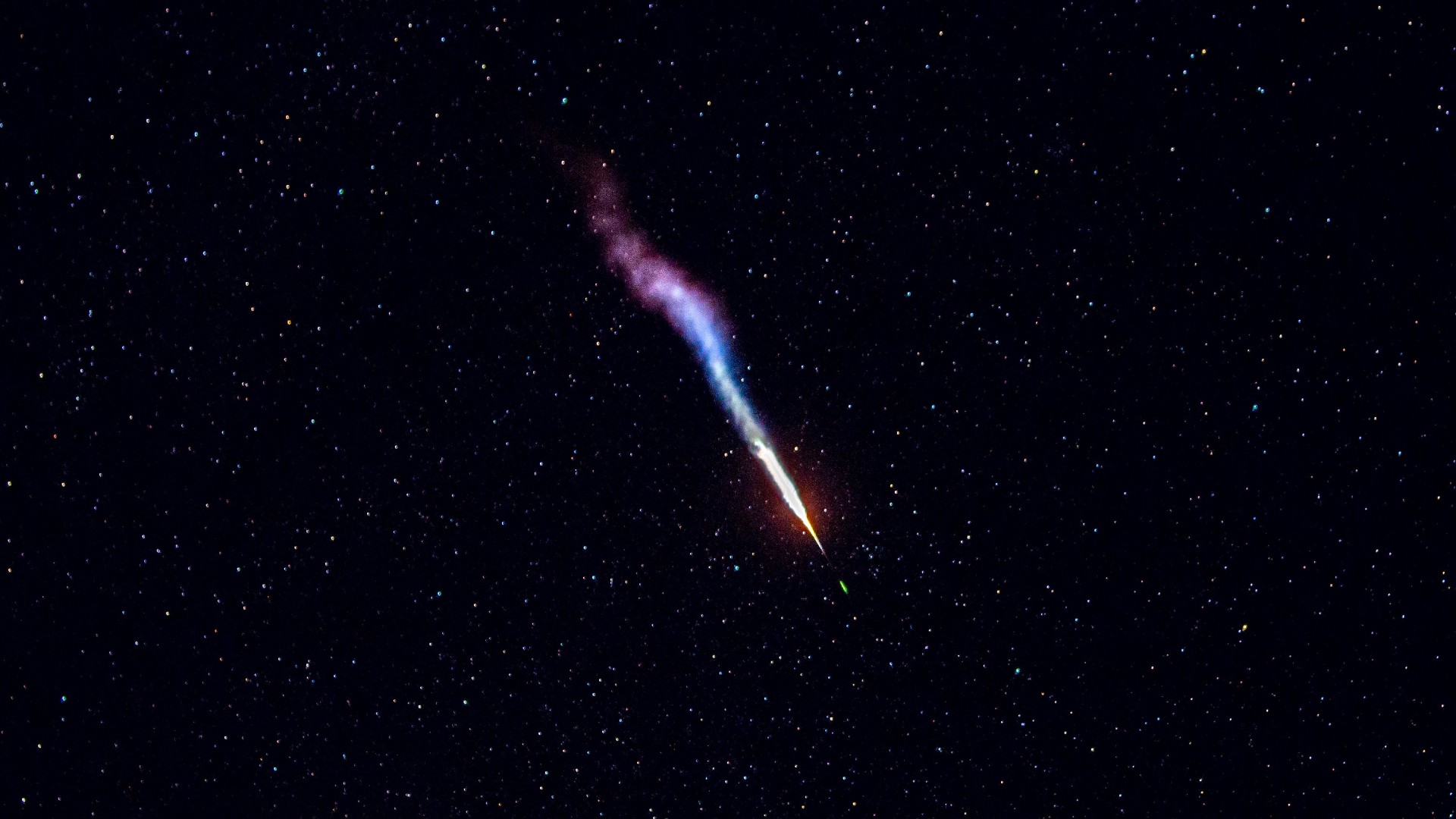 purple clouds of gas against a starry night sky