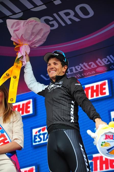 Julian Arredondo (Trek Factory Racing) raises his flowers on the Stage 18 podium