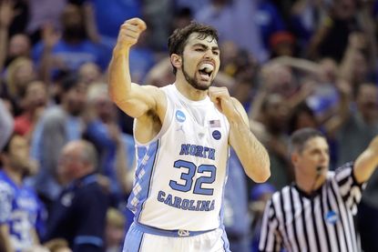 UNC player cheers as his team makes the NCAA championship.