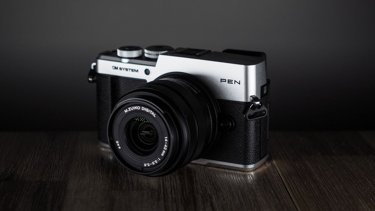 OM System OM-3 with the OM System M.Zuiko 14-42mm 3.5-5.6 III on a wooden surface
