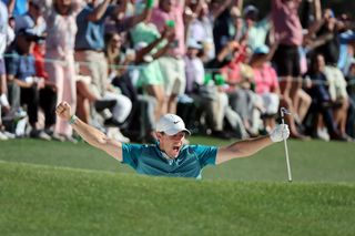 Rory McIlroy celebrates after bunker shot at the Masters