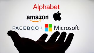 Big tech companies over top of a hand