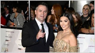 Michael Owen and Gemma Owen pose for photos on the red carpet at the NTAs 2022