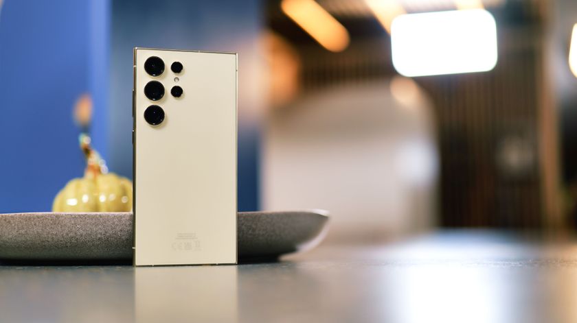 Samsung Galaxy S24 Ultra phone propped up on a plate