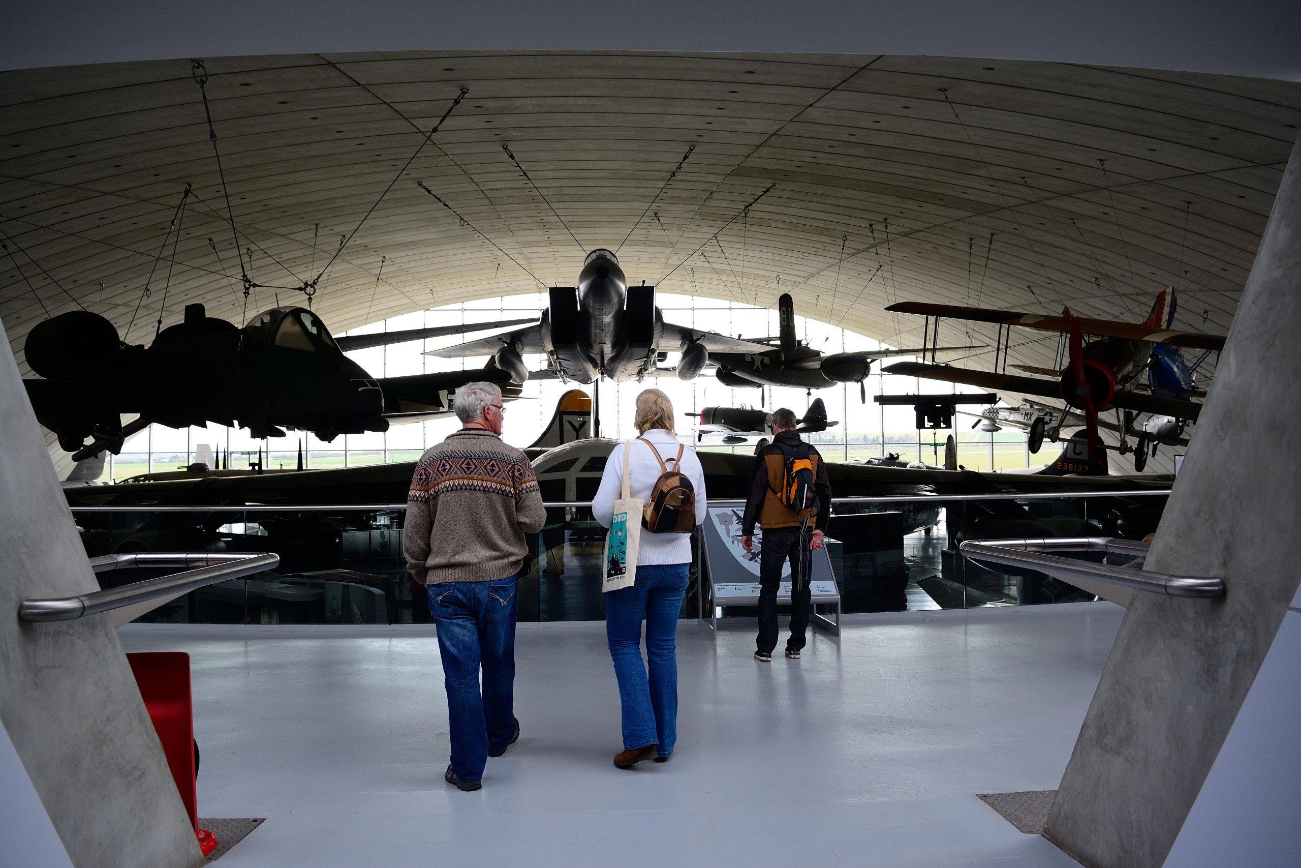 Tourists admire a collection of warplanes at the Imperial War Museum, Duxford.
