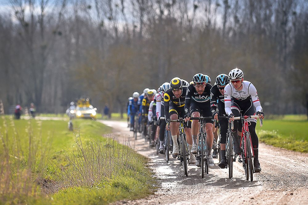 The peloton rides on the gravel roads during stage 1 at Paris-Nice