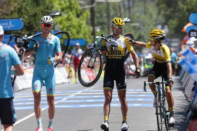 Lotto-Jumbo riders and Lars Boom (Astana) finish the stage on foot