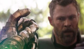 Thor watching Thanos snap his fingers in Avengers: Infinity War