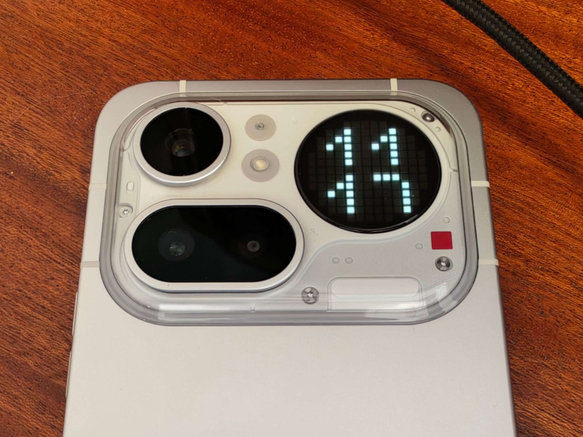 Detail of the camera bump showing the clock mode