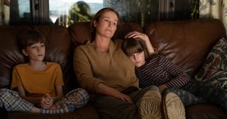 Jennifer Ehle, Wesley Holloway and Justine Colan snuggle together on a sofa in She Said