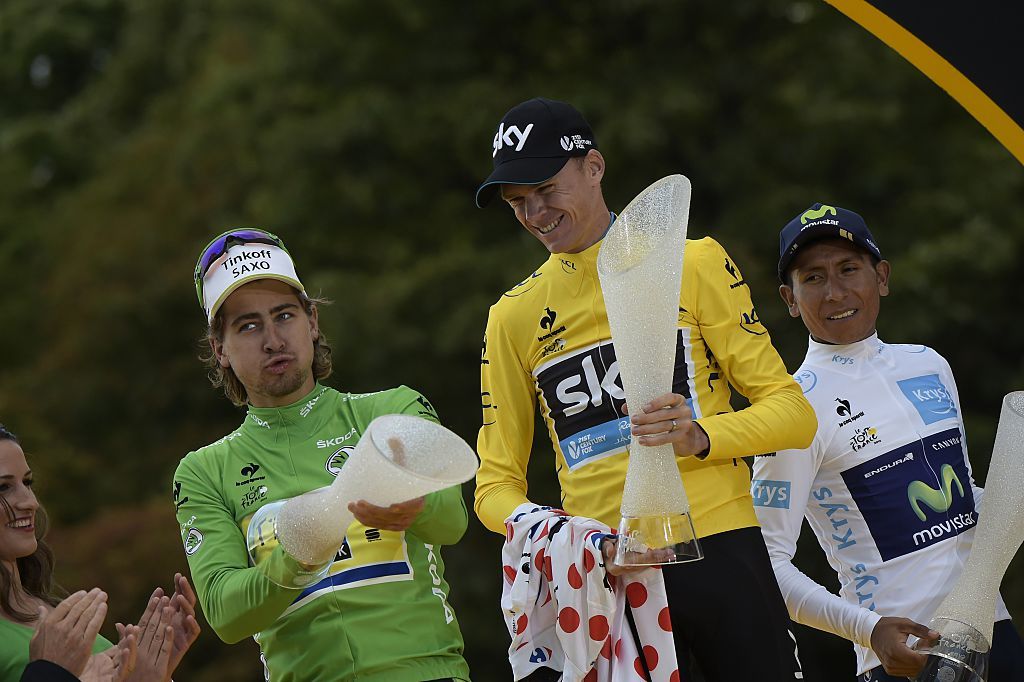 Tour de France 2015s winner Great Britains Christopher Froome C Slovakias Peter Sagan 3rd L wearing the best sprinters green jersey and Colombias Nairo Quintana 4th R wearing the best youngs white jersey hold their trophies on the podium on the ChampsElysees avenue in Paris at the end of the 1095 km twentyfirst and last stage of the 102nd edition of the Tour de France cycling race on July 26 2015 between Sevres and Paris AFP PHOTO LIONEL BONAVENTURE Photo credit should read LIONEL BONAVENTUREAFP via Getty Images