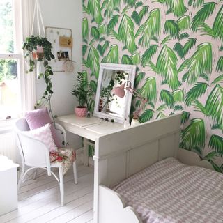room with wallpaper and white table and chair